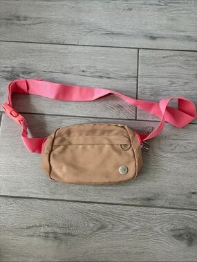 Neutral Tan Crossbody Belt Bag with Pink Strap